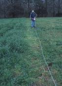 Picture of a man stringing electrical fencing